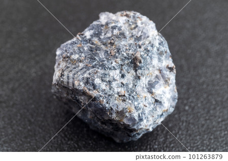 Crystal of cordierite iolite gem stone, raw mineral, black background 101263879