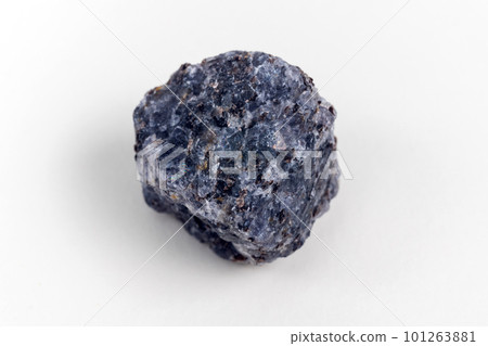 Crystal of cordierite iolite gem stone, raw mineral, white background 101263881