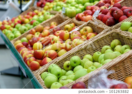 Apples on the shelves of a grocery store. Sale of fresh fruit. Selective focus 101263882