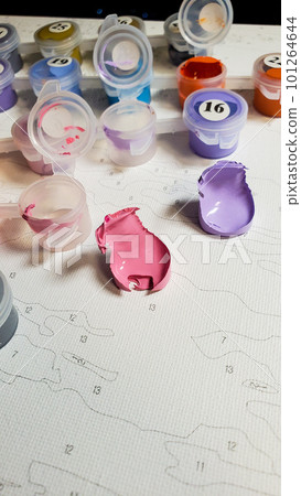 drawing by numbers. Selective focus. The acrylic paints in the drawing kit have dried up drawing by numbers. Selective focus. The acrylic paints in the drawing kit have dried up 101264644