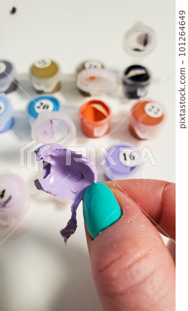 Painting on canvas by numbers with acrylic paints. The paint for drawing has dried up Painting on canvas by numbers with acrylic paints. The paint for drawing has dried up 101264649