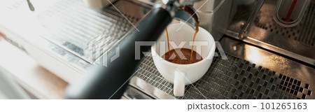 Professional coffee machine brewing coffee in cafeteria 101265163