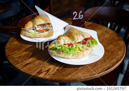 Appetizing croissants with coffee in a coffee shop. Appetizing croissants with coffee in a coffee shop. 101265797