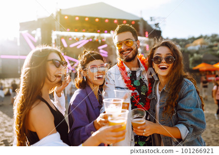 Group of friends with beer dancing and having fun at music festival together.Celebration concept. Group of friends with beer dancing and having fun at music festival together.Celebration concept. 101266921