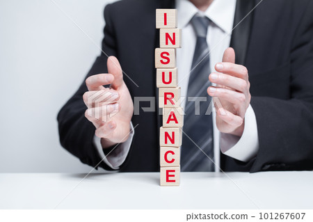 Wooden blocks with black word insurance, fragile pyramid, business insurance safety concept 101267607