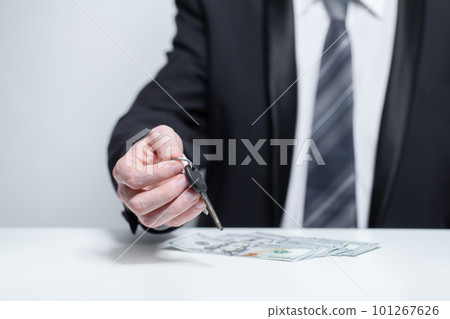 Us money dollars and keys in businesman hands  101267626