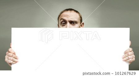 Man holding blank sign paper for advertising Man holding blank sign paper for advertising 101267629