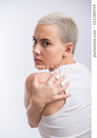 Pretty young woman with a short blond haircut on a white background. 101268554