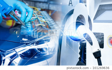 Electric vehicle charging station for charge EV battery and technician soldering metal of EV car lithium-ion rechargeable battery in factory. Commercial EV charging point business. Li-ion battery. Electric vehicle charging station for charge EV battery and technician soldering metal of EV car lithium-ion rechargeable battery in factory. Commercial EV charging point business. Li-ion battery. 101269636