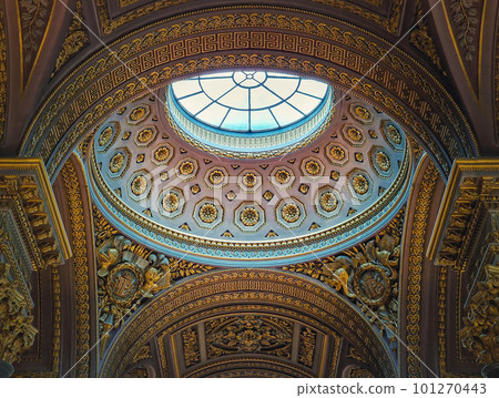 Closeup architectural details of the dome and golden ornate ceiling inside the Versailles palace hall, Gallery of Great Battles, the largest room in the castle of the sun king Louis XIV 101270443