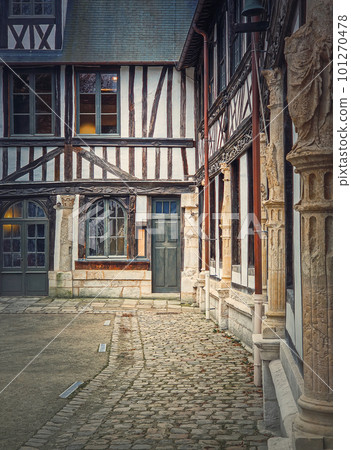 Saint-Maclou aitre, aster courtyard of medieval cemetery. Fachwerk architecture, half timbered facades details of the buildings located in Rouen, Normandy, France Saint-Maclou aitre, aster courtyard of medieval cemetery. Fachwerk architecture, half timbered facades details of the buildings located in Rouen, Normandy, France 101270478