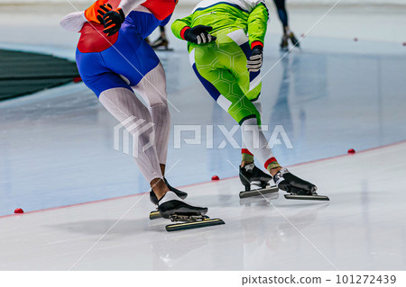 back two male skaters run together warm-up speed skating competition, winter sports games 101272439