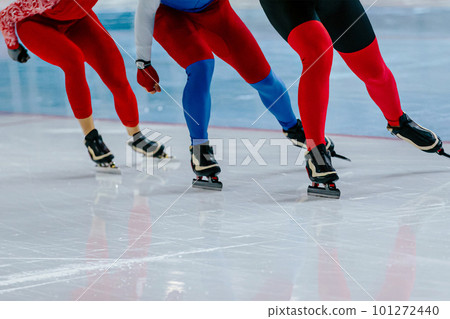 three male skaters run together warm-up speed skating competition, winter sports games three male skaters run together warm-up speed skating competition, winter sports games 101272440