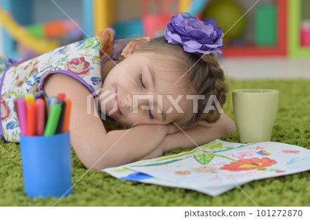 Cute schoolgirl sleeping at her homework at home Cute schoolgirl sleeping at her homework at home 101272870