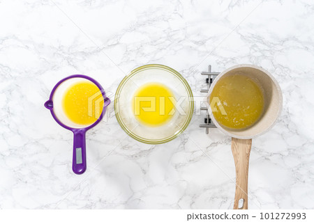 Flat lay. Melted sticks of unsalted butter on the counter. Flat lay. Melted sticks of unsalted butter on the counter. 101272993