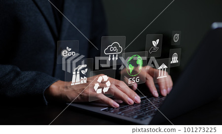 Businessman use a computer to analyze ESG data. icons pop up on virtual screen in business sustainability investment strategy concept. ESG environmental social governance investment business concept. Businessman use a computer to analyze ESG data. icons pop up on virtual screen in business sustainability investment strategy concept. ESG environmental social governance investment business concept. 101273225