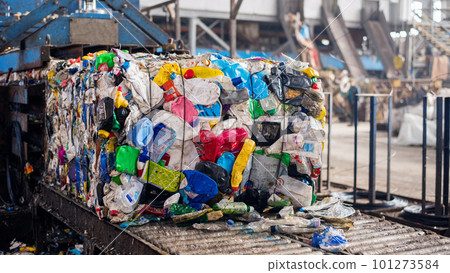 Compressed plastic garbage at waste sorting plant Compressed plastic garbage at waste sorting plant 101273584