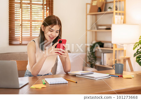 Female fashion artist checking photo of new fashion collection i Female fashion artist checking photo of new fashion collection i 101273668