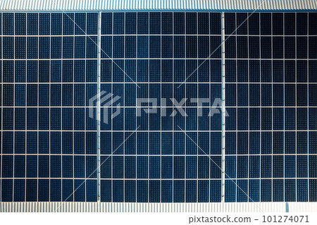 Multiple solar panels on the roof of a manufacturing building 101274071