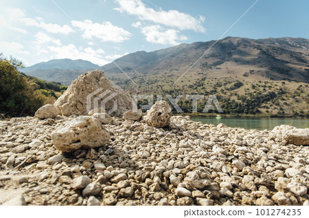 Kournas Mountain Lake in Greece. Cozy summer day and calm water in the lake Kournas Mountain Lake in Greece. Cozy summer day and calm water in the lake 101274235