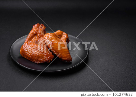 Delicious grilled chicken wings with spices and herbs Delicious grilled chicken wings with spices and herbs 101274652