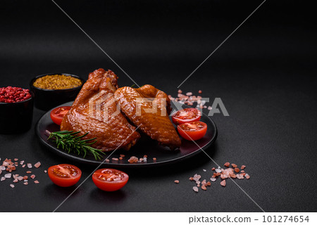 Delicious grilled chicken wings with spices and herbs Delicious grilled chicken wings with spices and herbs 101274654