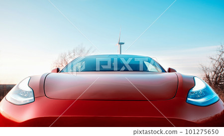 Parked red electric car at sunset Parked red electric car at sunset 101275650