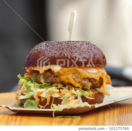 Tasty fresh chipotle burger on the table at farmers market Tasty fresh chipotle burger on the table at farmers market 101275760