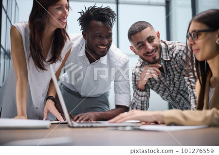 Happy young female worker discussing online project, showing presentation to experienced team leader in glasses. 101276559