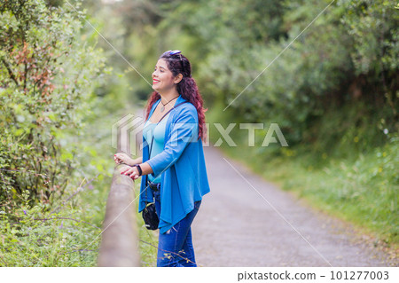 thinking outside in nature wellness self care relaxation. south american woman in senda del oso thinking outside in nature wellness self care relaxation. south american woman in senda del oso 101277003