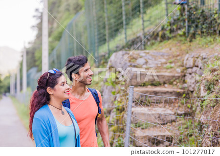 Senda del oso, Teverga Asturias. mixed race travelers couple hiking ecotourism conservation path Senda del oso, Teverga Asturias. mixed race travelers couple hiking ecotourism conservation path 101277017