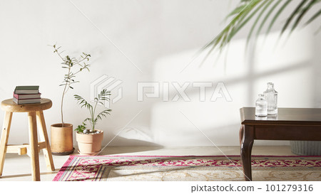 A room with a calm atmosphere, with clay pots placed in front of the wall and curtains letting in natural light. Glass bottles, coffee, and various objects on a marble table A room with a calm atmosphere, with clay pots placed in front of the wall and curtains letting in natural light. Glass bottles, coffee, and various objects on a marble table 101279316