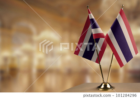 Small flags of the Thailand on an abstract blurry background 101284296
