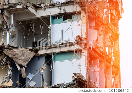 dismantled old building. Half demolished house, dismantling of the old one for the construction of a new building dismantled old building. Half demolished house, dismantling of the old one for the construction of a new building 101286242
