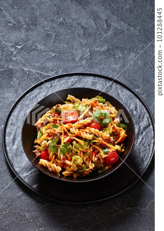 pasta salad with ground beef and veggies in bowl pasta salad with ground beef and veggies in bowl 101288445