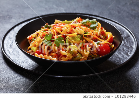 pasta salad with ground beef and veggies in bowl pasta salad with ground beef and veggies in bowl 101288446