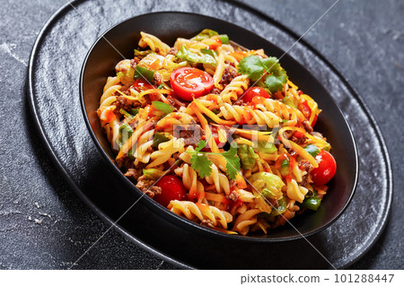pasta salad with ground beef and veggies in bowl pasta salad with ground beef and veggies in bowl 101288447