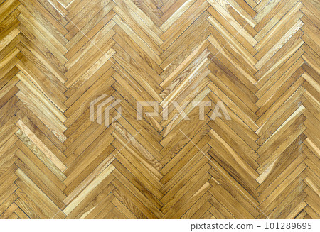 Wooden parquet floor background. Old vintage parquet on the floor in the living room. Interior design concept. Wooden parquet floor background. Old vintage parquet on the floor in the living room. Interior design concept. 101289695