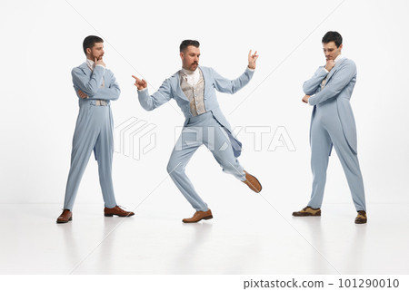 Shot of three man wearing elegant outfit entertaining together over white studio background. Let's dance Shot of three man wearing elegant outfit entertaining together over white studio background. Let's dance 101290010