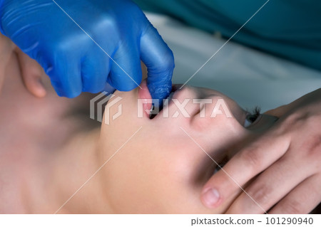 Session of craniosacral therapy, cure of teen boy's jaws by a doctor therapist. Session of craniosacral therapy, cure of teen boy's jaws by a doctor therapist. 101290940