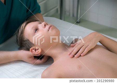 Session of craniosacral therapy, cure of teen boy's neck by a doctor therapist. 101290980