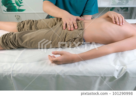 Session of craniosacral therapy, cure of teen boy's stomach by doctor therapist. 101290998