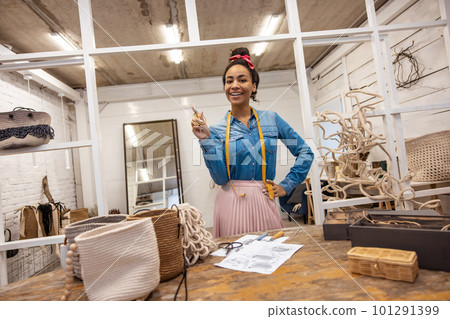 Cute young woman in an art studio looking joyful Cute young woman in an art studio looking joyful 101291399