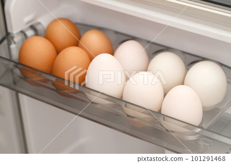 Organic chicken and white duck eggs in the fridge fresh from the farm ready for breakfast. Organic chicken and white duck eggs in the fridge fresh from the farm ready for breakfast. 101291468
