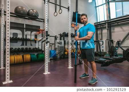 Man in sportswear exercising in a gym Man in sportswear exercising in a gym 101291529