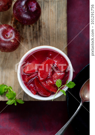 Red plums confiture, jam or fruit sauce in a bowl, top voiew 101291756