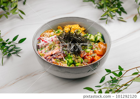 Portion of salmon poke bowl with vegetables Portion of salmon poke bowl with vegetables 101292120
