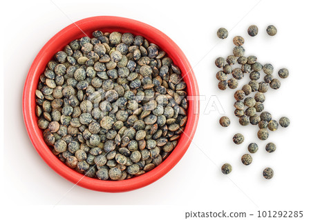 raw french green lentils in ceramic bowl isolated on white background. Top view. Flat lay raw french green lentils in ceramic bowl isolated on white background. Top view. Flat lay 101292285