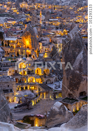 Goreme City at twilight, Famous tourist center of balloon fligths in Cappadocia, Turkiye, Aerial view twilight Goreme City from the mountain, Night view of Goreme, Cappadocia, Turkey. 101293133