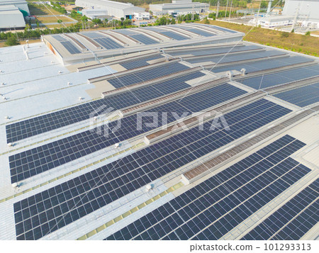 Aerial view of solar panels or solar cells on the roof of factory building rooftop. Power plant, renewable clean energy source. Eco technology for electric power in industry. 101293313